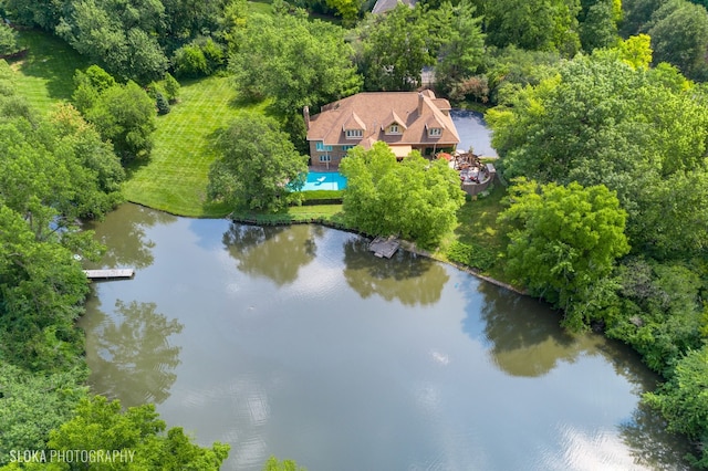 birds eye view of property with a water view