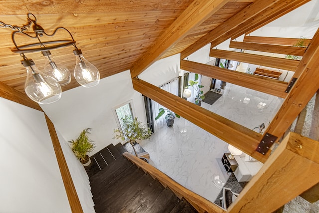 stairway with wood ceiling