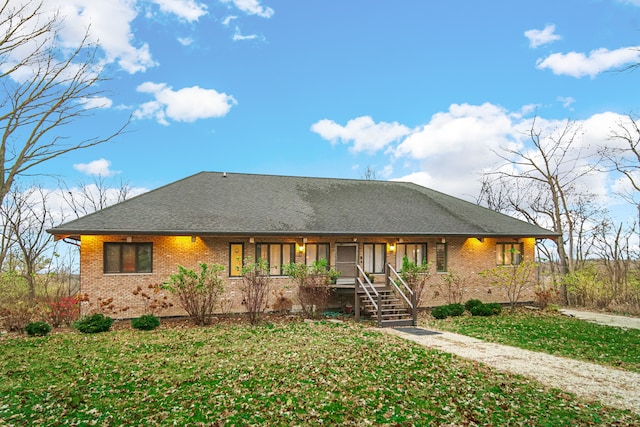 view of front of home featuring a porch and a front lawn