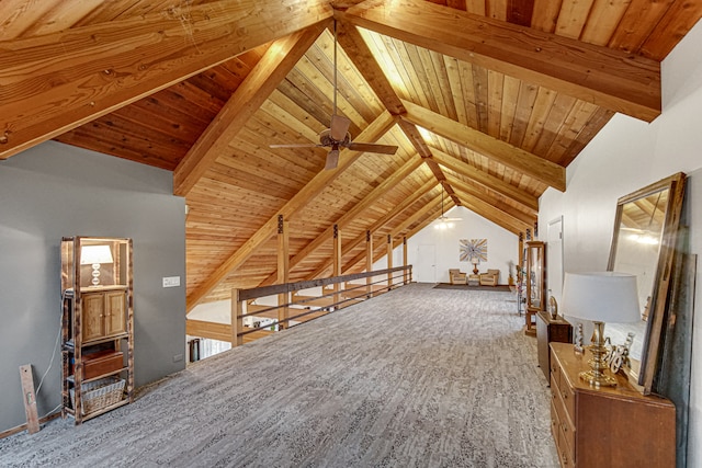 additional living space with lofted ceiling with beams, ceiling fan, and wood ceiling