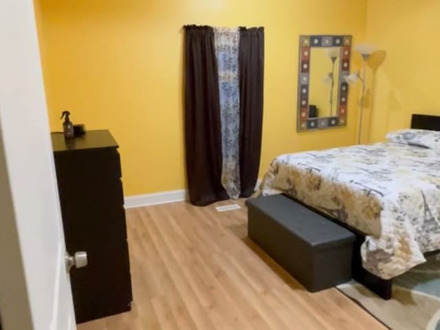 bedroom featuring light wood-type flooring