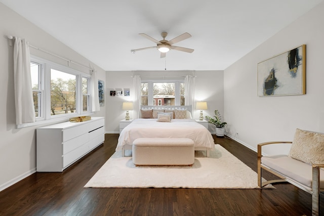 bedroom featuring ceiling fan and dark hardwood / wood-style floors