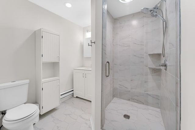 bathroom featuring vanity, toilet, and a shower with shower door