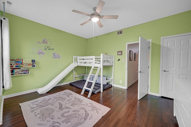 bedroom with ceiling fan and dark hardwood / wood-style floors