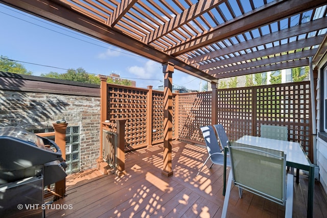 wooden deck featuring a pergola