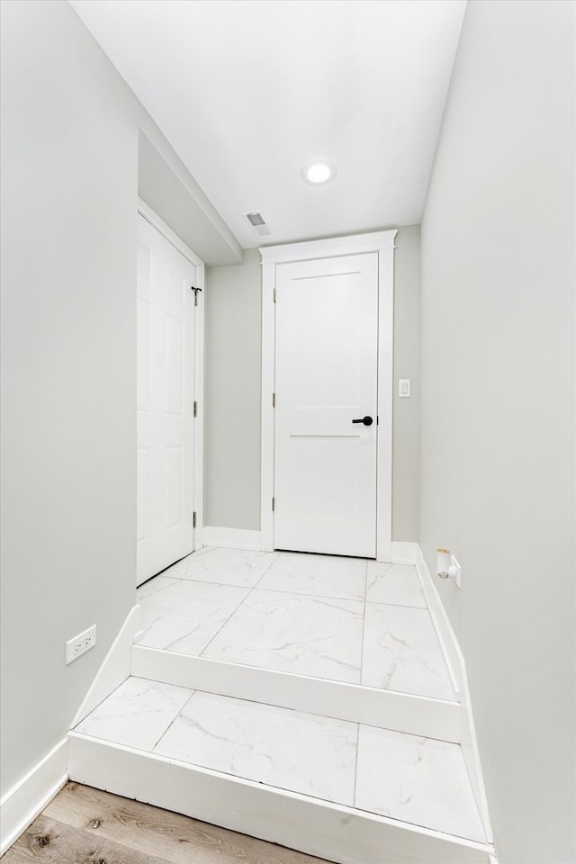 hallway featuring hardwood / wood-style flooring