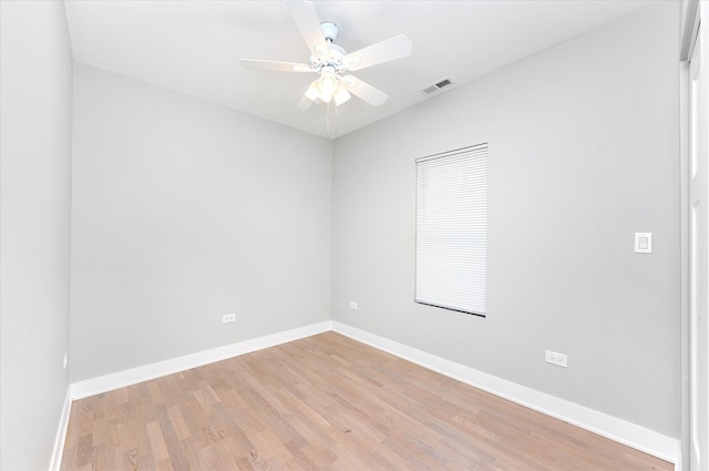 spare room with light hardwood / wood-style floors and ceiling fan