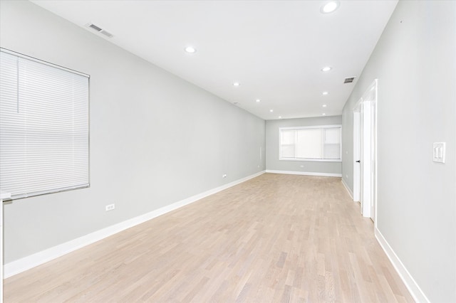 unfurnished room with light hardwood / wood-style flooring