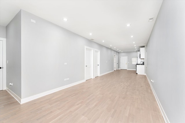 unfurnished living room featuring light hardwood / wood-style floors