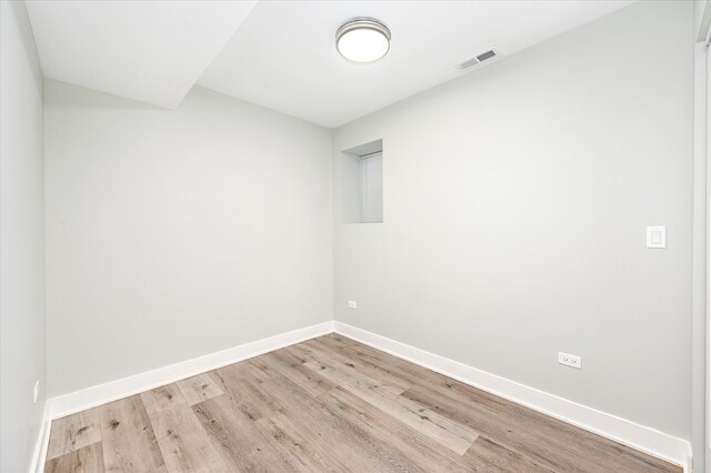 unfurnished room featuring light hardwood / wood-style flooring