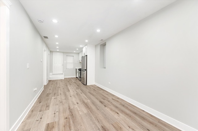 unfurnished living room featuring light wood-type flooring