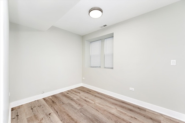 unfurnished room with light hardwood / wood-style flooring