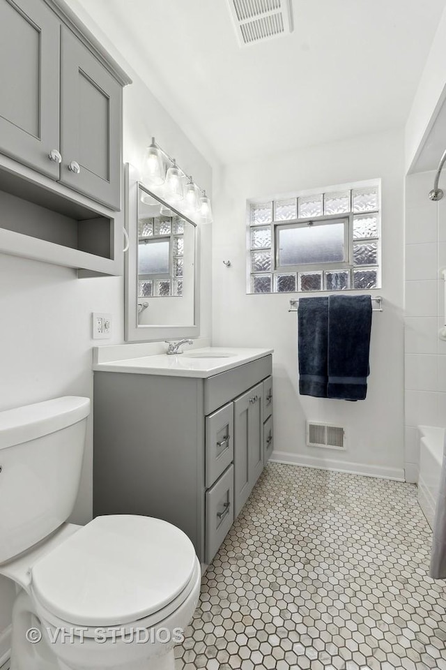 full bathroom with toilet,  shower combination, and vanity