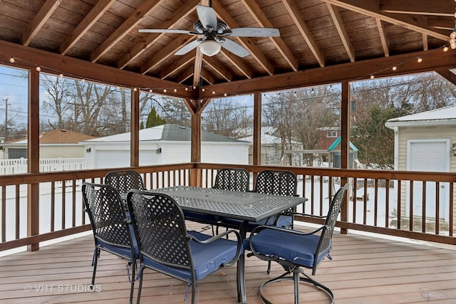 snow covered deck featuring ceiling fan and a gazebo