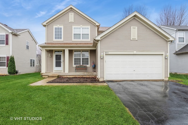 view of property featuring a garage, covered porch, and a front lawn