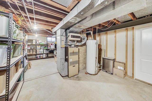 basement featuring heating unit and water heater