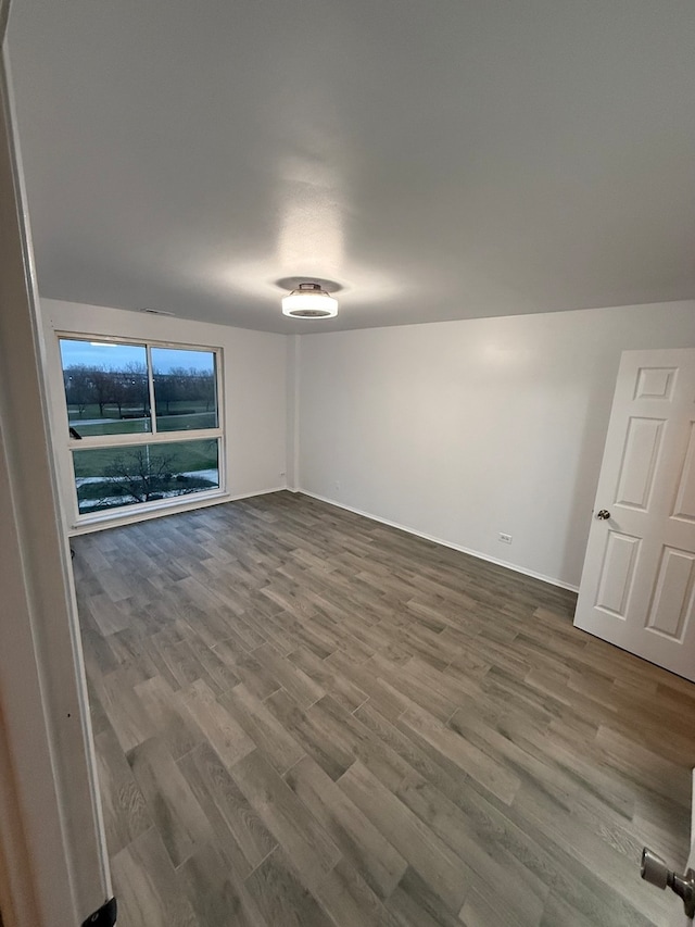 spare room featuring hardwood / wood-style floors