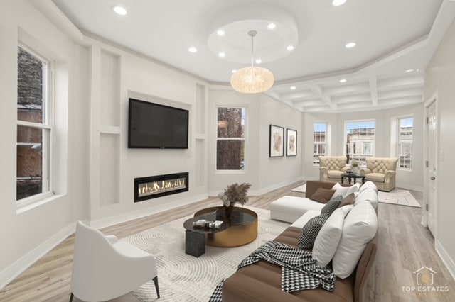 living room featuring beamed ceiling, light hardwood / wood-style floors, an inviting chandelier, and coffered ceiling