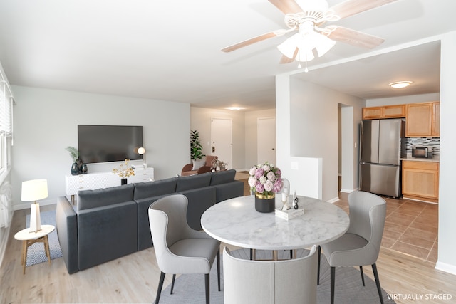 dining room featuring ceiling fan and light hardwood / wood-style floors