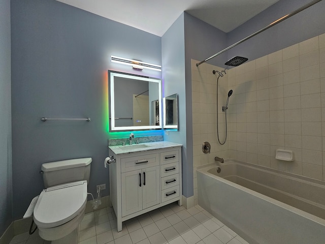 full bathroom featuring tile patterned flooring, vanity, toilet, and tiled shower / bath