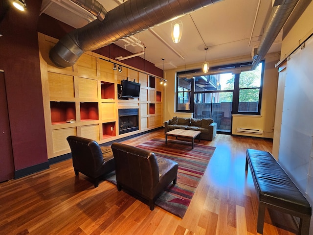 living room featuring hardwood / wood-style floors and a baseboard radiator