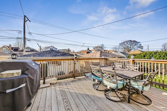 wooden terrace with area for grilling