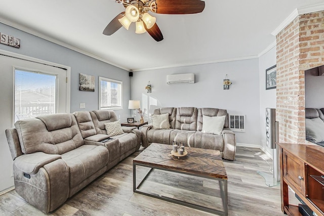 living room featuring a wall mounted AC, ceiling fan, light hardwood / wood-style floors, and ornamental molding