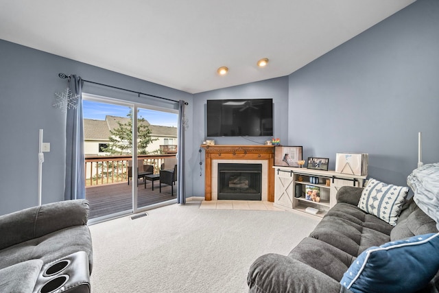 carpeted living room featuring vaulted ceiling