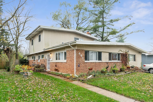 view of home's exterior featuring a lawn