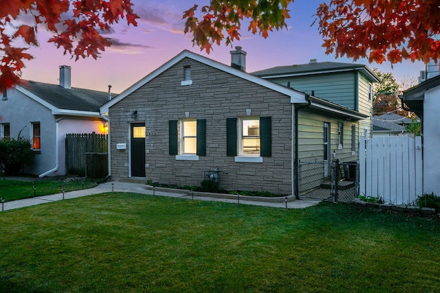 view of front of property with a yard