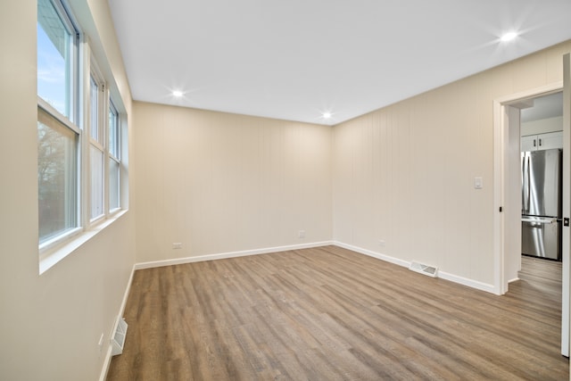 empty room with light wood-type flooring