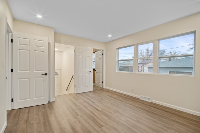 unfurnished bedroom featuring light hardwood / wood-style floors