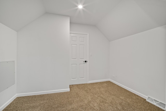 bonus room featuring carpet flooring and lofted ceiling