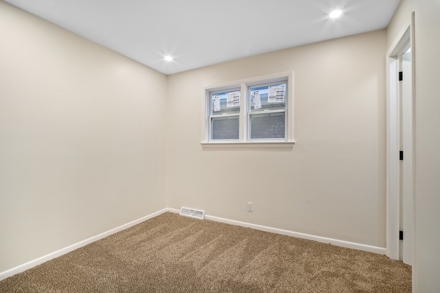 spare room featuring carpet flooring