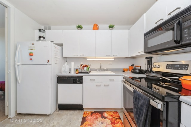 kitchen with white cabinets, white appliances, and sink