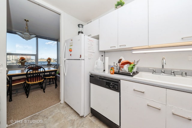 kitchen with white cabinetry, sink, and white appliances