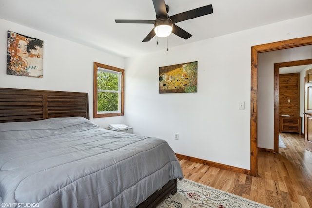 bedroom with light wood-type flooring and ceiling fan