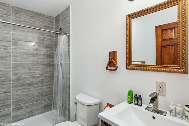 bathroom with walk in shower, sink, and toilet