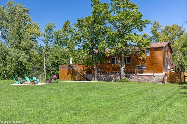 view of yard with a patio and a fire pit