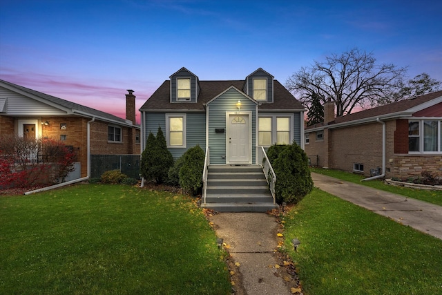 view of front of home with a lawn