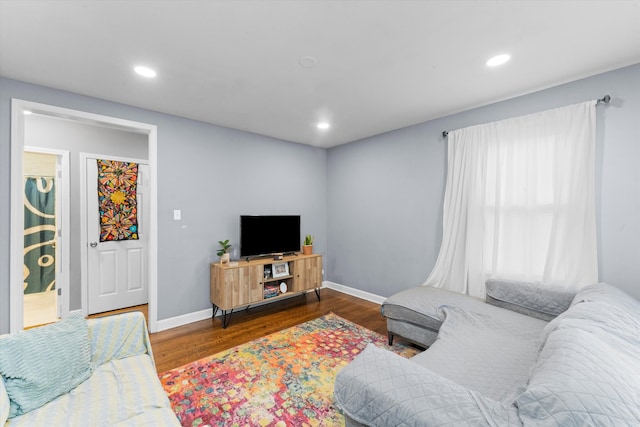 living room with dark hardwood / wood-style floors