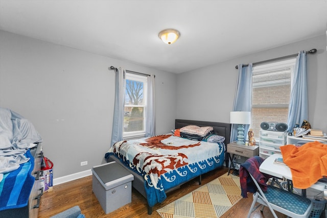 bedroom with dark wood-type flooring