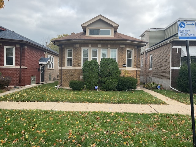 bungalow with a front yard