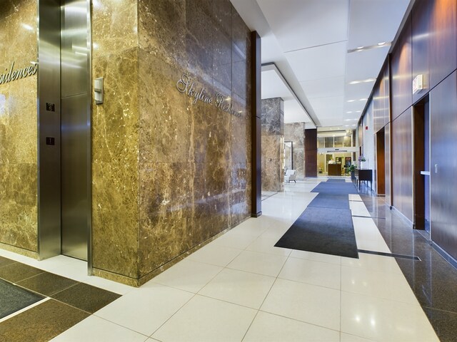 655 W Irving Park Rd Unit 1710, Chicago, IL 60613 - building lobby with tile walls
