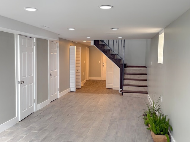 basement featuring light hardwood / wood-style floors