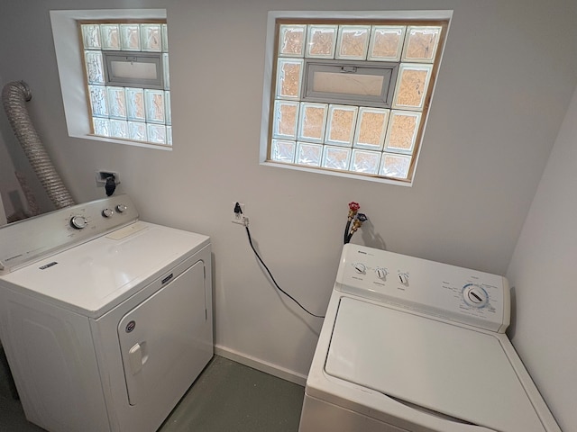 laundry area with washing machine and clothes dryer