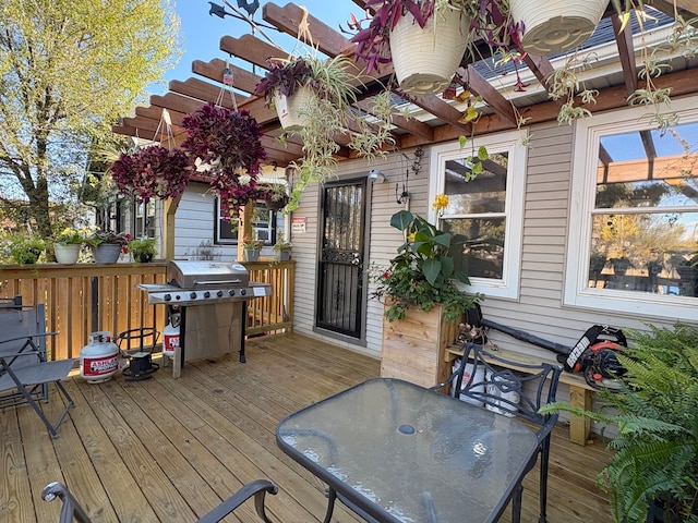 deck with a pergola and grilling area