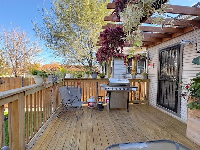 deck featuring a pergola and a grill