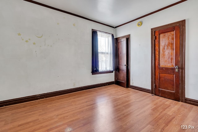 unfurnished bedroom with light hardwood / wood-style floors and ornamental molding