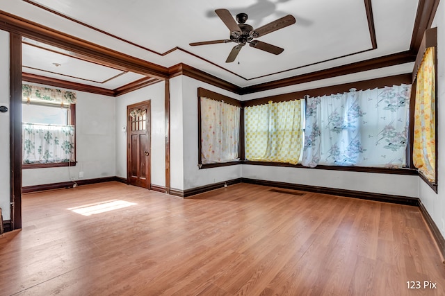 spare room with ceiling fan, light hardwood / wood-style floors, and ornamental molding